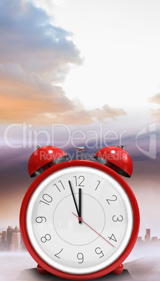 Composite image of alarm clock counting down to twelve