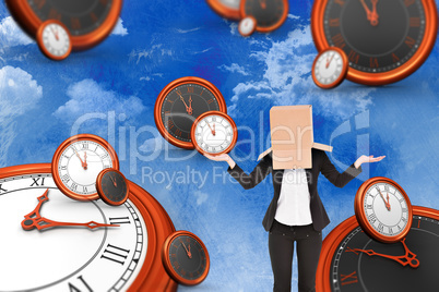 Composite image of businesswoman with box over head