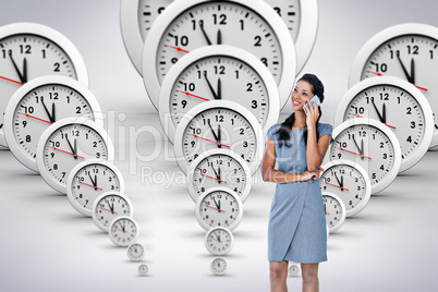 Composite image of businesswoman on the phone