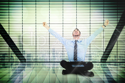 Composite image of businessman cheering with tablet sitting on f