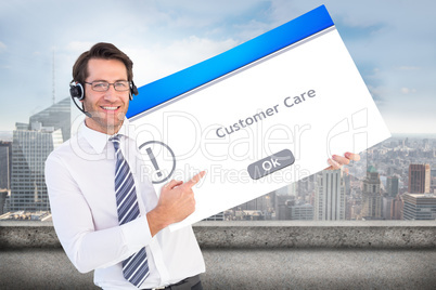 Composite image of businessman with headphone showing card to ca