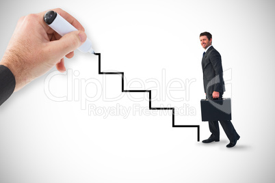 Composite image of businessman walking with his briefcase