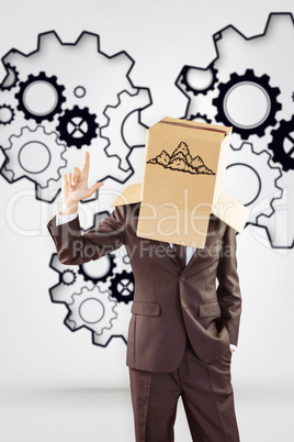 Composite image of anonymous businessman pointing up with finger