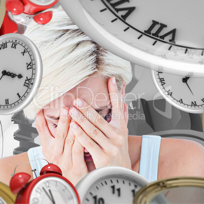 Composite image of sad blonde woman crying with head on hands