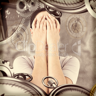 Composite image of sad woman hiding her face