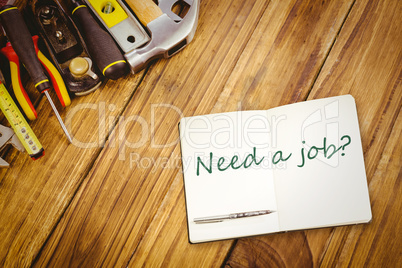 Need a job? against desk with tools