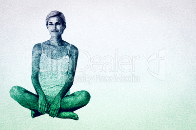 Composite image of smiling blonde woman sitting on the floor