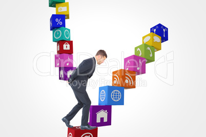 Composite image of businessman putting hands behind