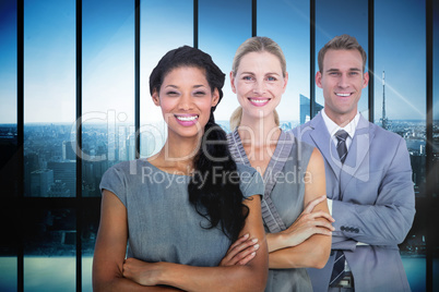 Composite image of happy business team smiling at camera