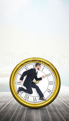 Composite image of geeky young businessman running mid air