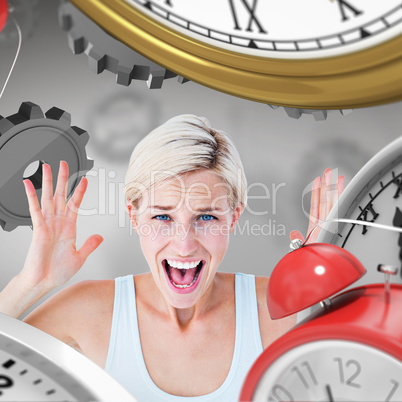 Composite image of angry blonde screaming with hands up