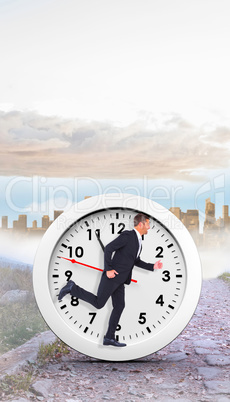 Composite image of businessman running