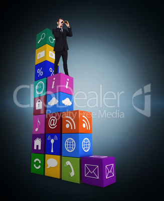 Composite image of elegant businessman standing and using binocu