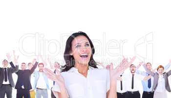 Composite image of surprised brunette with hands up