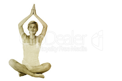 Composite image of fit woman doing yoga