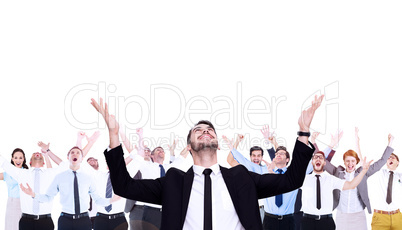 Composite image of businessman cheering with hands raised