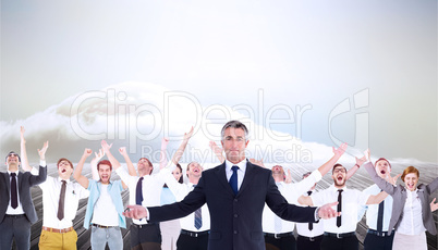 Composite image of businessman in suit spreading his arms