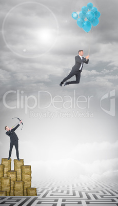 Composite image of businessman shooting a bow and arrow