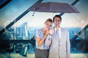 Composite image of business people holding a black umbrella
