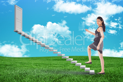 Composite image of businesswoman stepping up