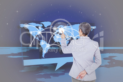 Composite image of businesswoman pointing