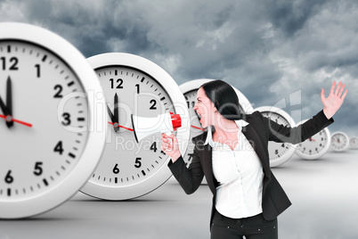 Composite image of pretty businesswoman shouting with megaphone