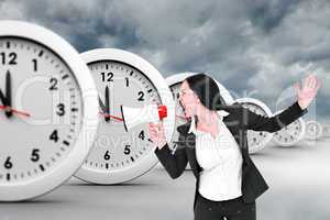 Composite image of pretty businesswoman shouting with megaphone