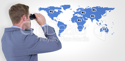 Composite image of businessman using binoculars