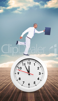 Composite image of businessman running with briefcase Composite image of businessman running with briefcase