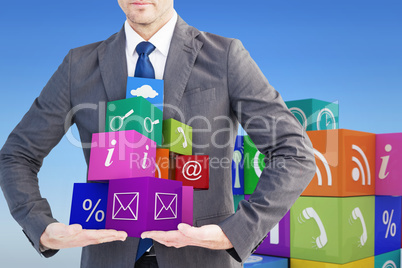 Composite image of businessman presenting your product with hand