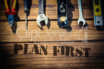 Plan first against desk with tools