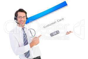 Composite image of businessman with headphone showing card to ca