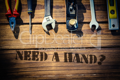Need a hand? against desk with tools