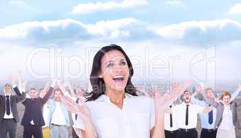 Composite image of surprised brunette with hands up