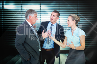 Composite image of business people having a disagreement