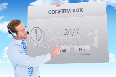 Composite image of businessman presenting card wearing headset