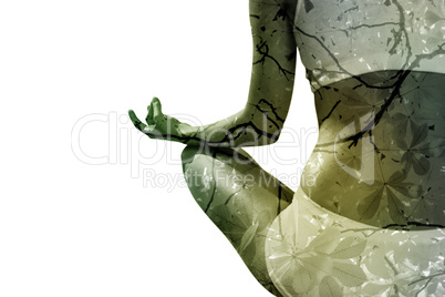 Composite image of fit woman sitting in lotus pose