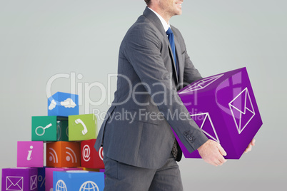 Composite image of businessman holding something with his hands