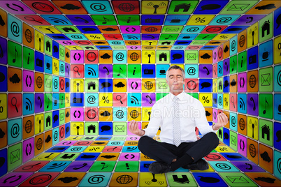 Composite image of zen businessman meditating in lotus pose Composite image of zen businessman meditating in lotus pose