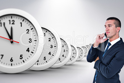 Composite image of businessman having phone call