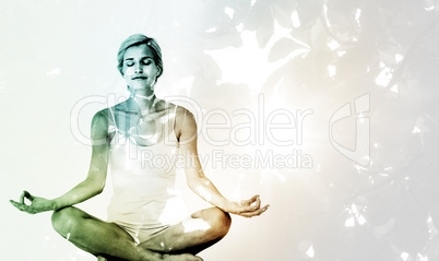 Composite image of  fit woman doing yoga