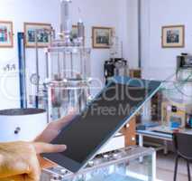 Composite image of man using tablet pc