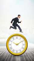 Composite image of geeky young businessman running mid air