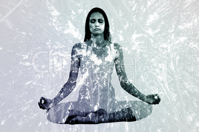 Composite image of toned woman in lotus pose at fitness studio