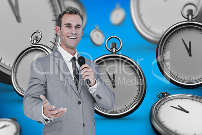 Composite image of businessman giving speech