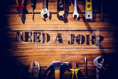 Need a job? against desk with tools