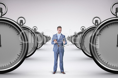 Composite image of businessman holding scales of justice