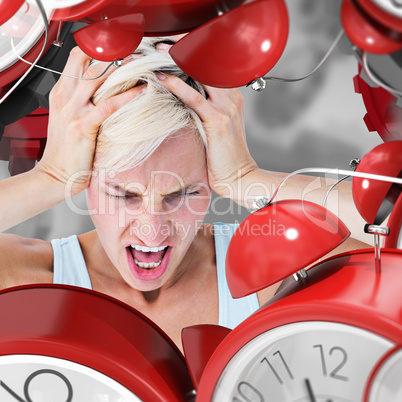 Composite image of angry blonde woman screaming and holding her