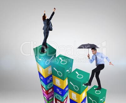 Composite image of focused businessman holding umbrella and bala