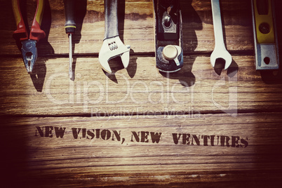 New vision, new  ventures against desk with tools